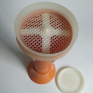 Vintage poedersuiker strooier van Tupperware in de kleur oranje