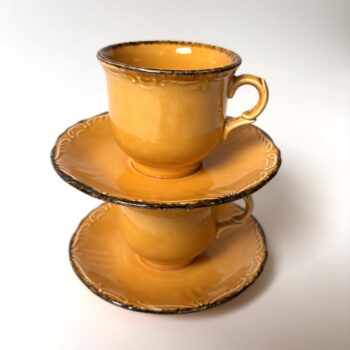 Vintage kop met schotel van Pagnossin Treviso Italy in een warme okergele kleur